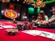 K9K9 showcases an upscale poker scene with vibrant chips and an elegant roulette wheel, capturing the excitement of gambling.