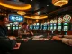 Players enjoying a thrilling game at B52 CLUB poker table in a lively casino atmosphere.